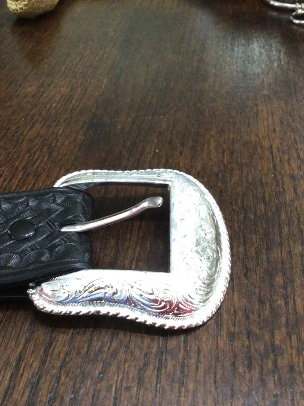 Genuine leather western belt with Silvertone buckle. Size 36.